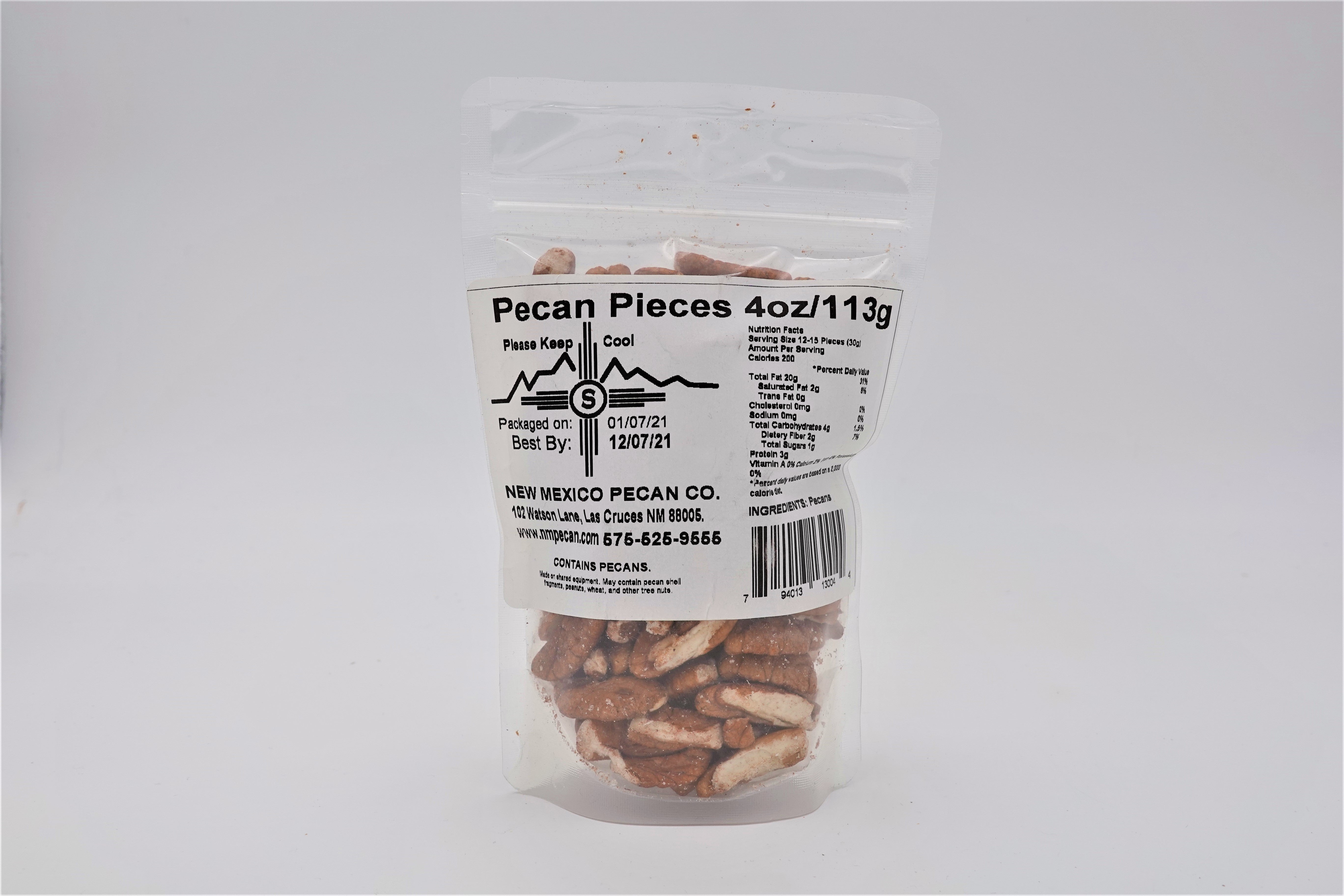 A clear plastic package of Pecan Pieces pecan pieces, labeled as 4 oz/113g, displays nutritional information with pecans visible behind the label, making it a perfect