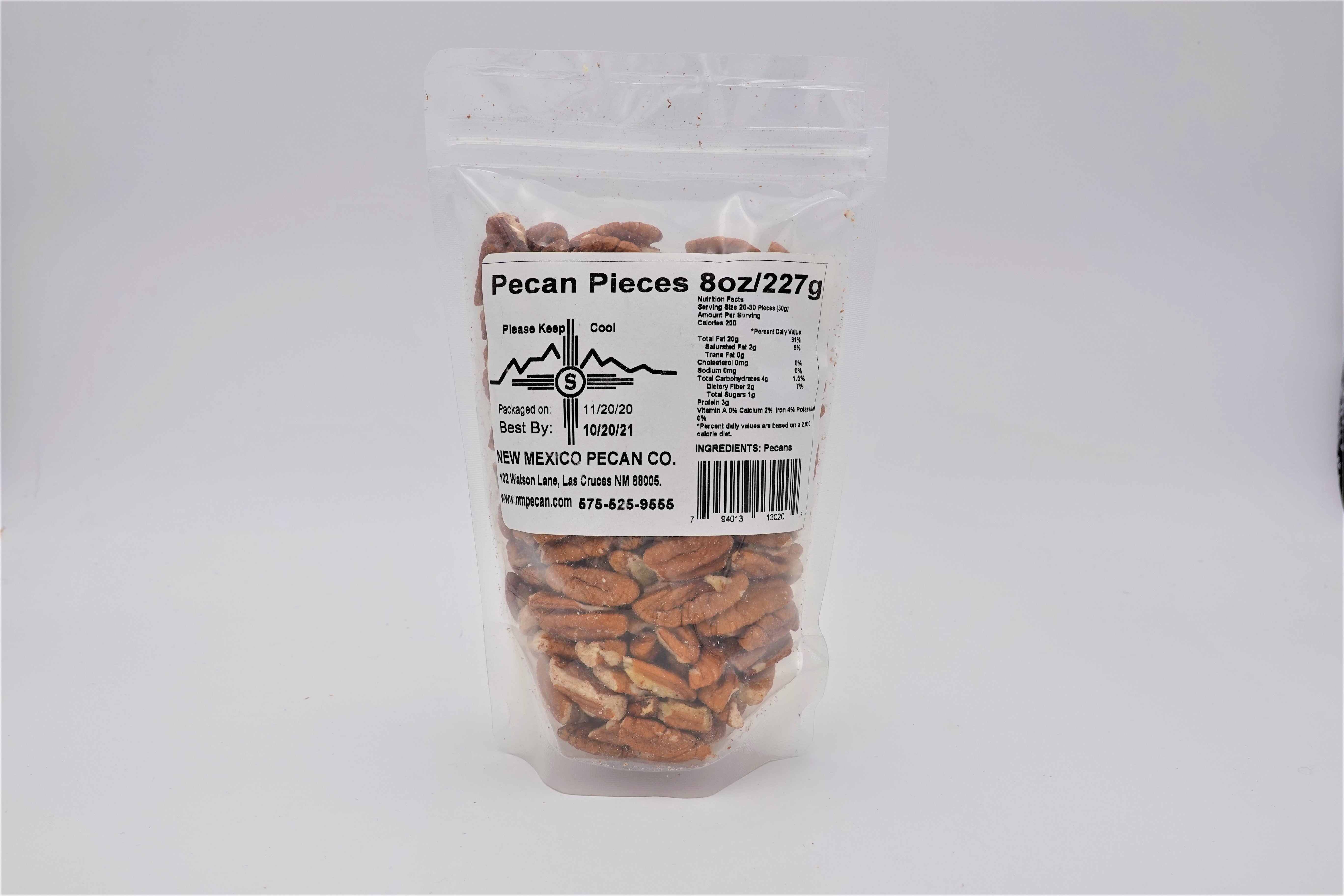 Sentence with product name: A sealed plastic bag containing 8 ounces of Pecan Pieces set against a plain white background. The label includes nutritional information and indicates the product is "fresh packed.