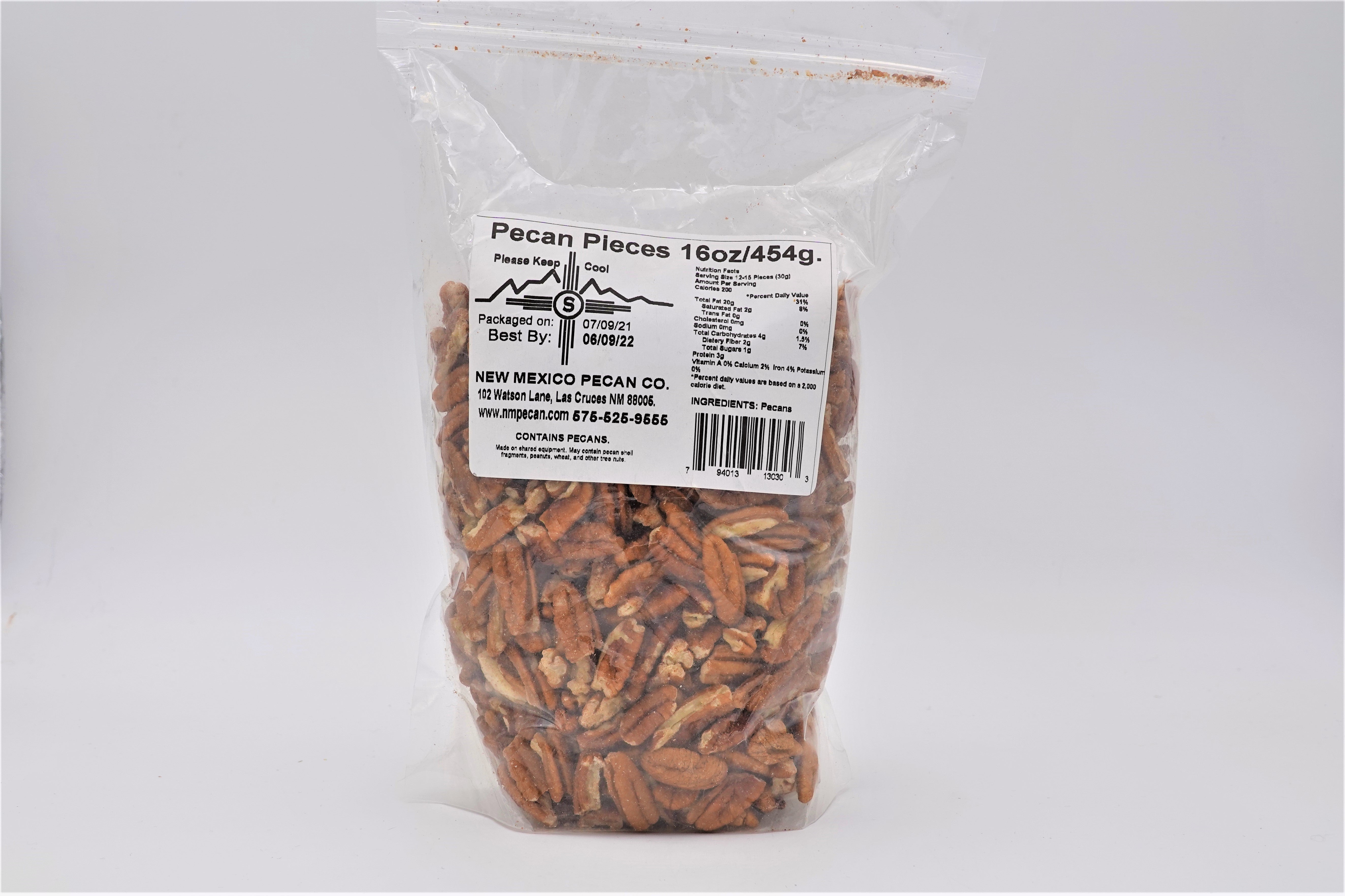 Sentence with product name: A clear plastic bag containing 16 ounces of Pecan Pieces, with labels including nutritional info, barcode, and best-by date visible. The background is plain white.