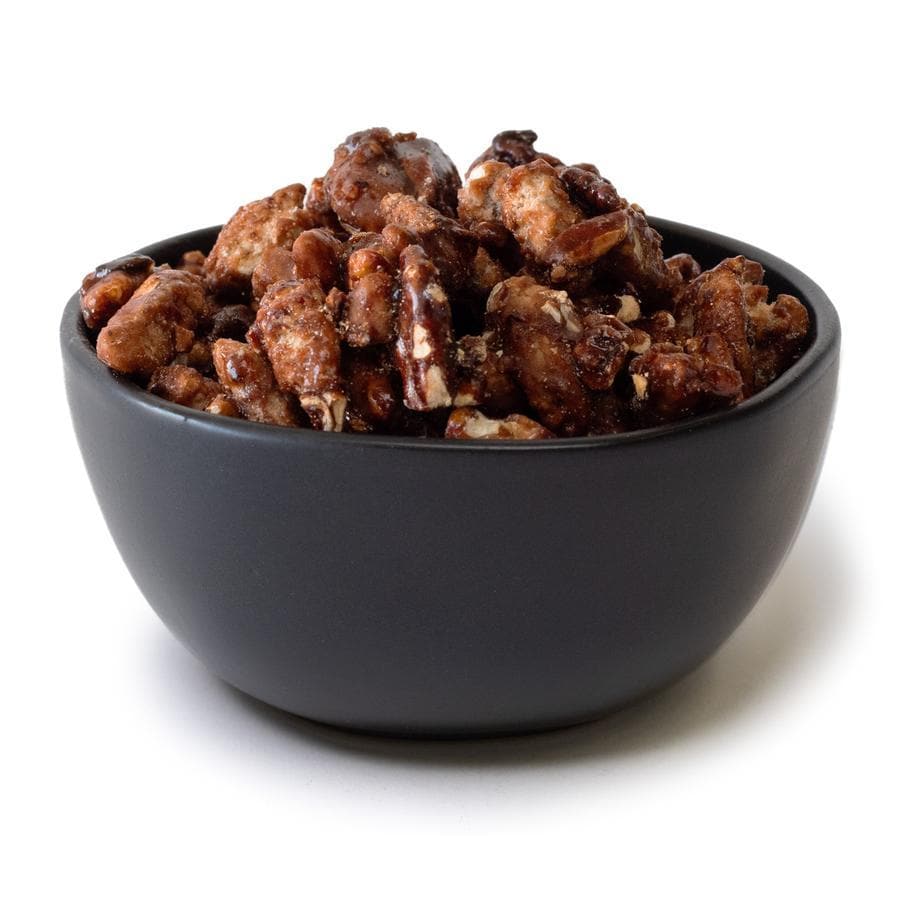 Sentence with product name: A bowl of glazed pecans with a glossy, sugary coating, isolated on a white background.