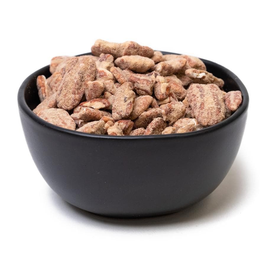 A black bowl filled with Sweet & Hot Pecans, isolated on a white background.