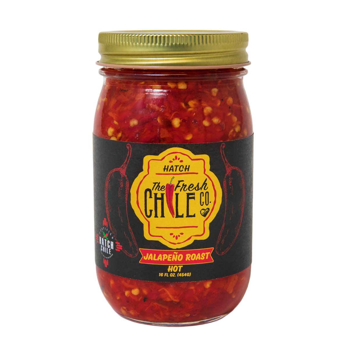 A jar of Hatch Red Jalapeño Roast, labeled as hot, filled with chopped red jalapeños and spices, against a solid black background.